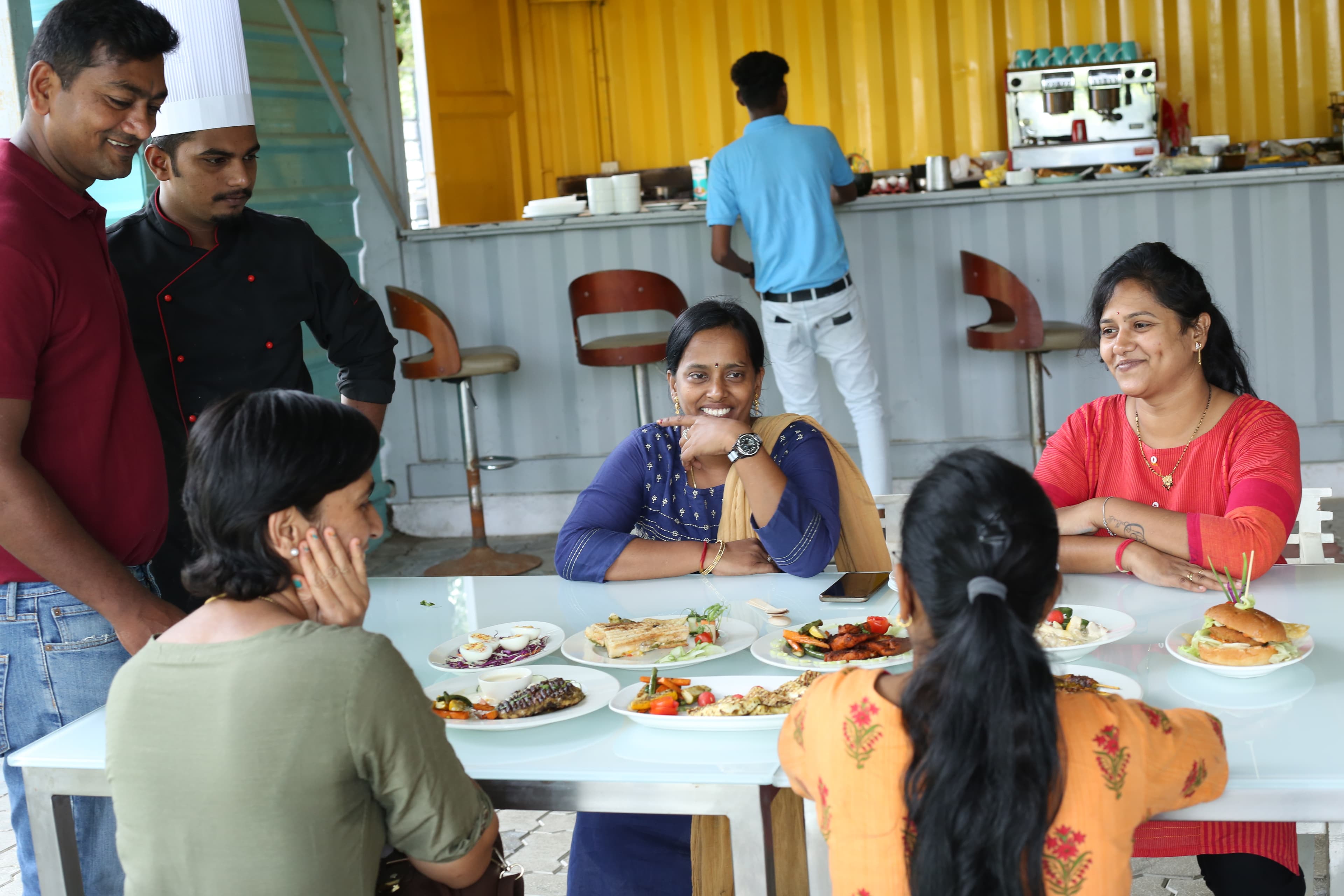 Guests dining with the Blackboard Cafe team